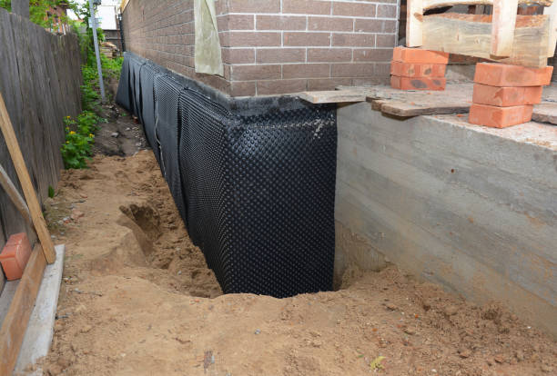 Happy homeowners after waterproofing job in Alvada